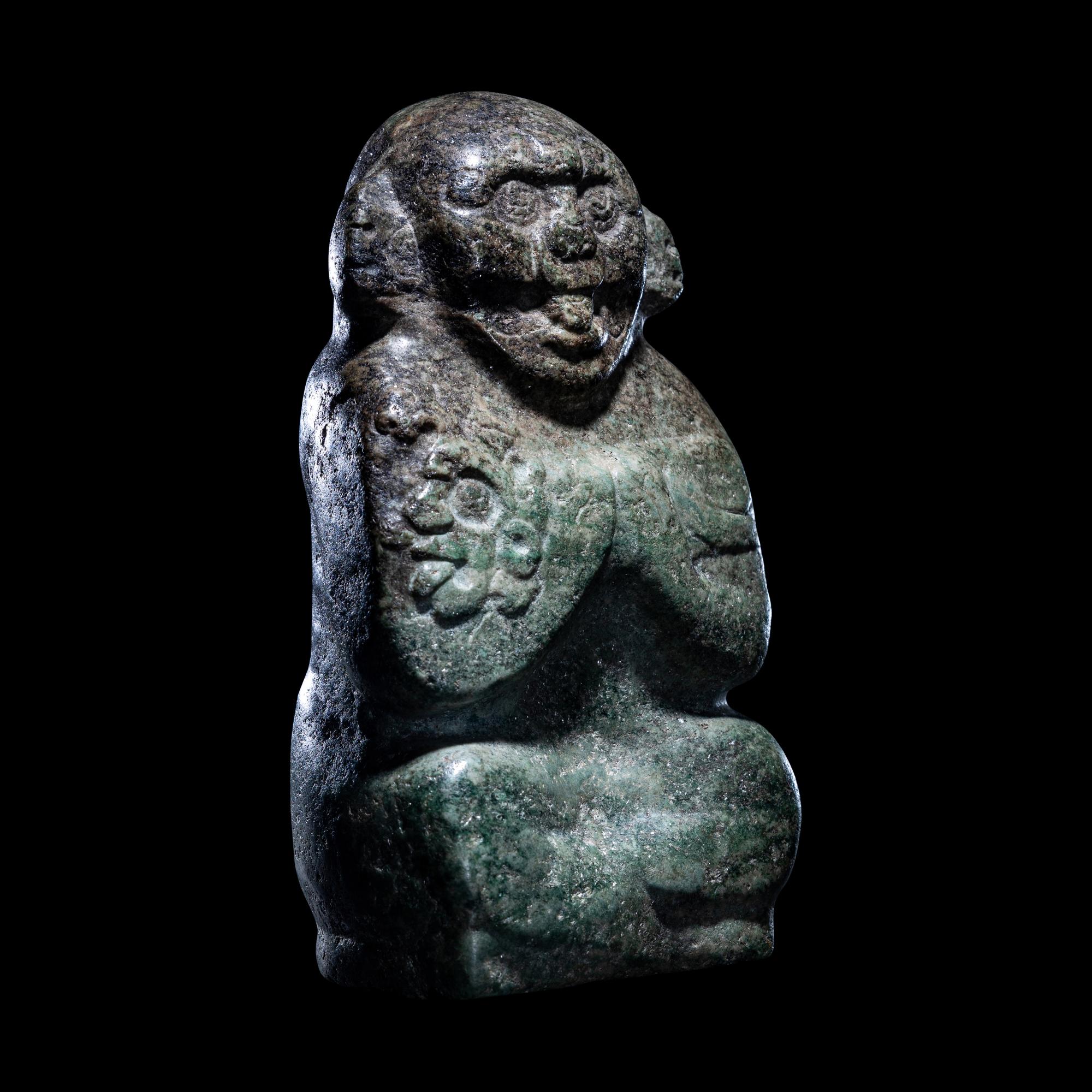 An Early Maya Stone Seated Deity