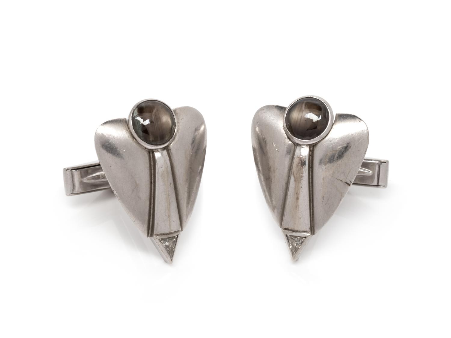 A Pair of White Gold, Black Star Sapphire and Diamond Cufflinks,