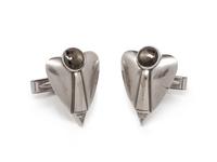 A Pair of White Gold, Black Star Sapphire and Diamond Cufflinks,