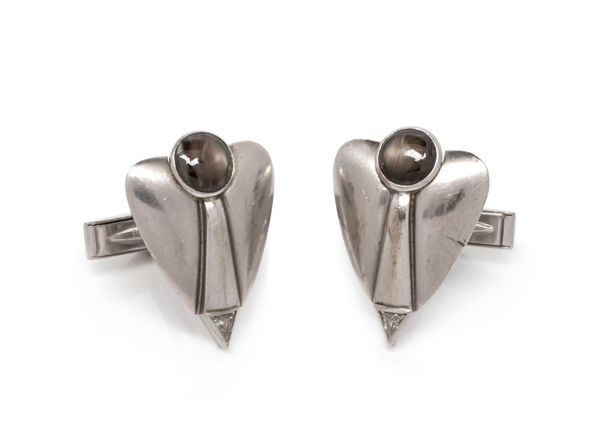 A Pair of White Gold, Black Star Sapphire and Diamond Cufflinks,