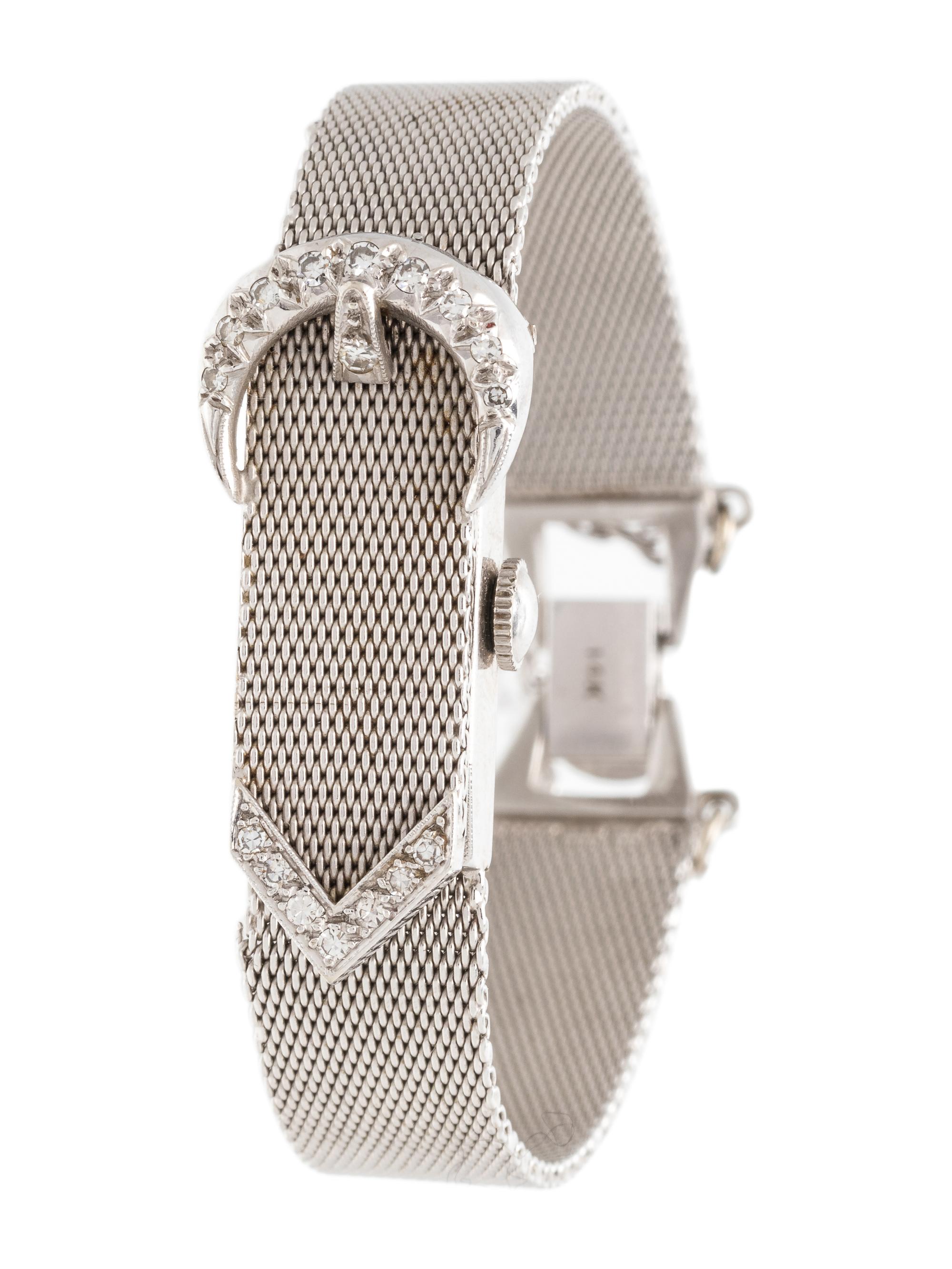 BAUME & MERCIER, 14K WHITE GOLD AND DIAMOND SURPRISE WRISTWATCH