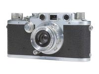 [CAMERAS]. Leica III 35mm camera with accessories and contemporary literature.