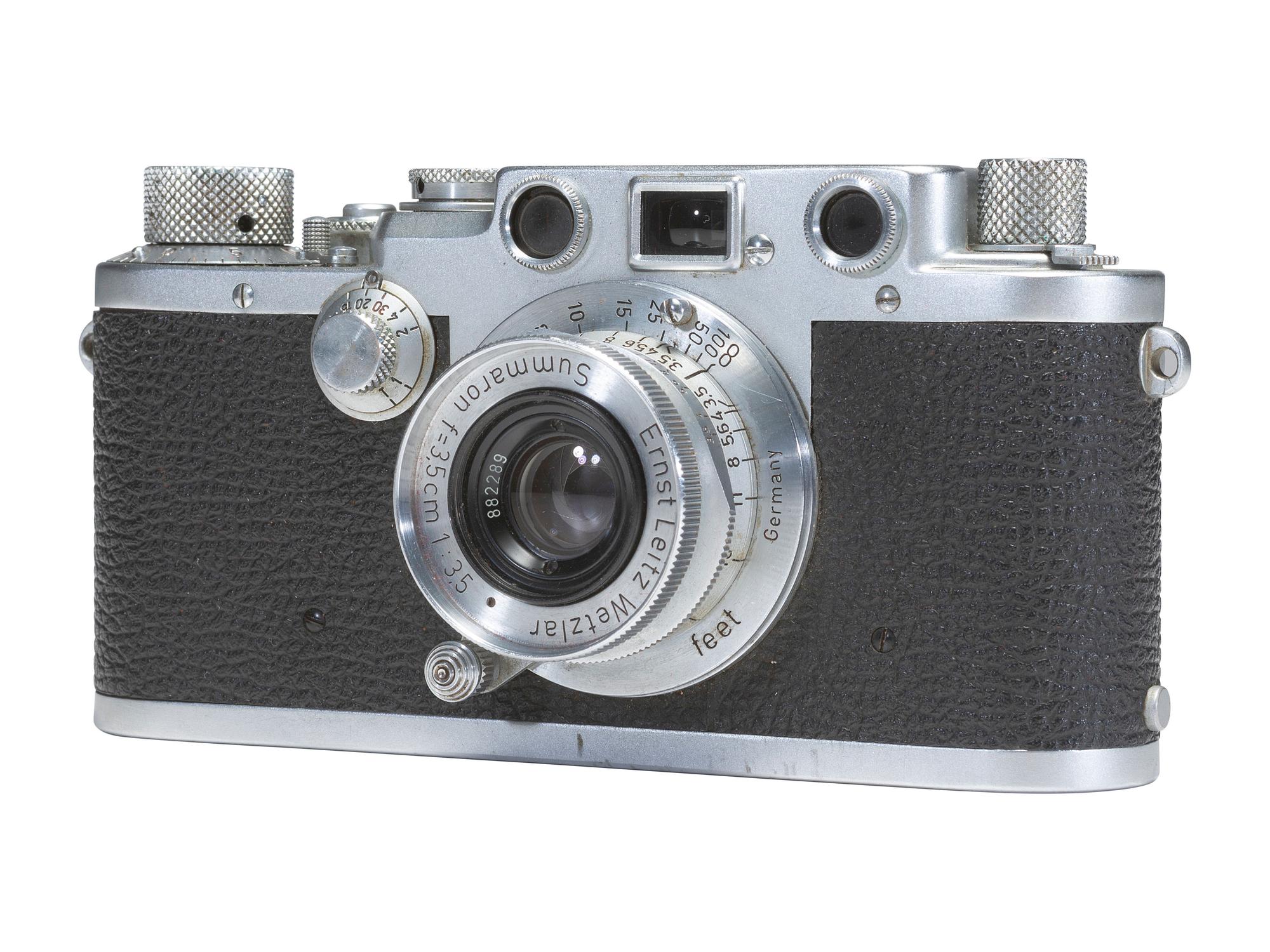 [CAMERAS]. Leica III 35mm camera with accessories and contemporary literature.