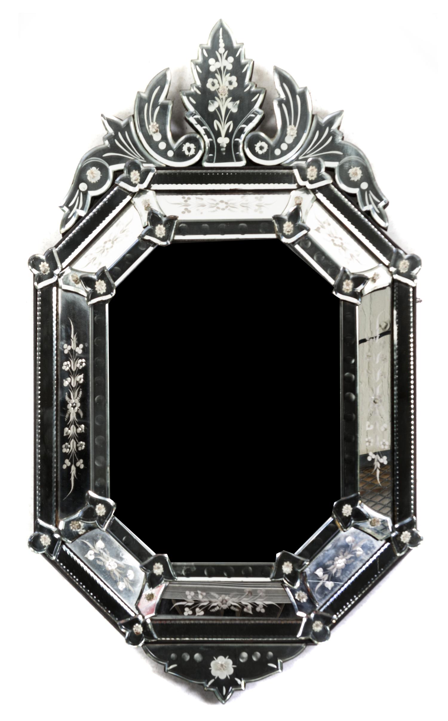 A Venetian Glass Mirror, Height 34 x width 19 3/4 inches.