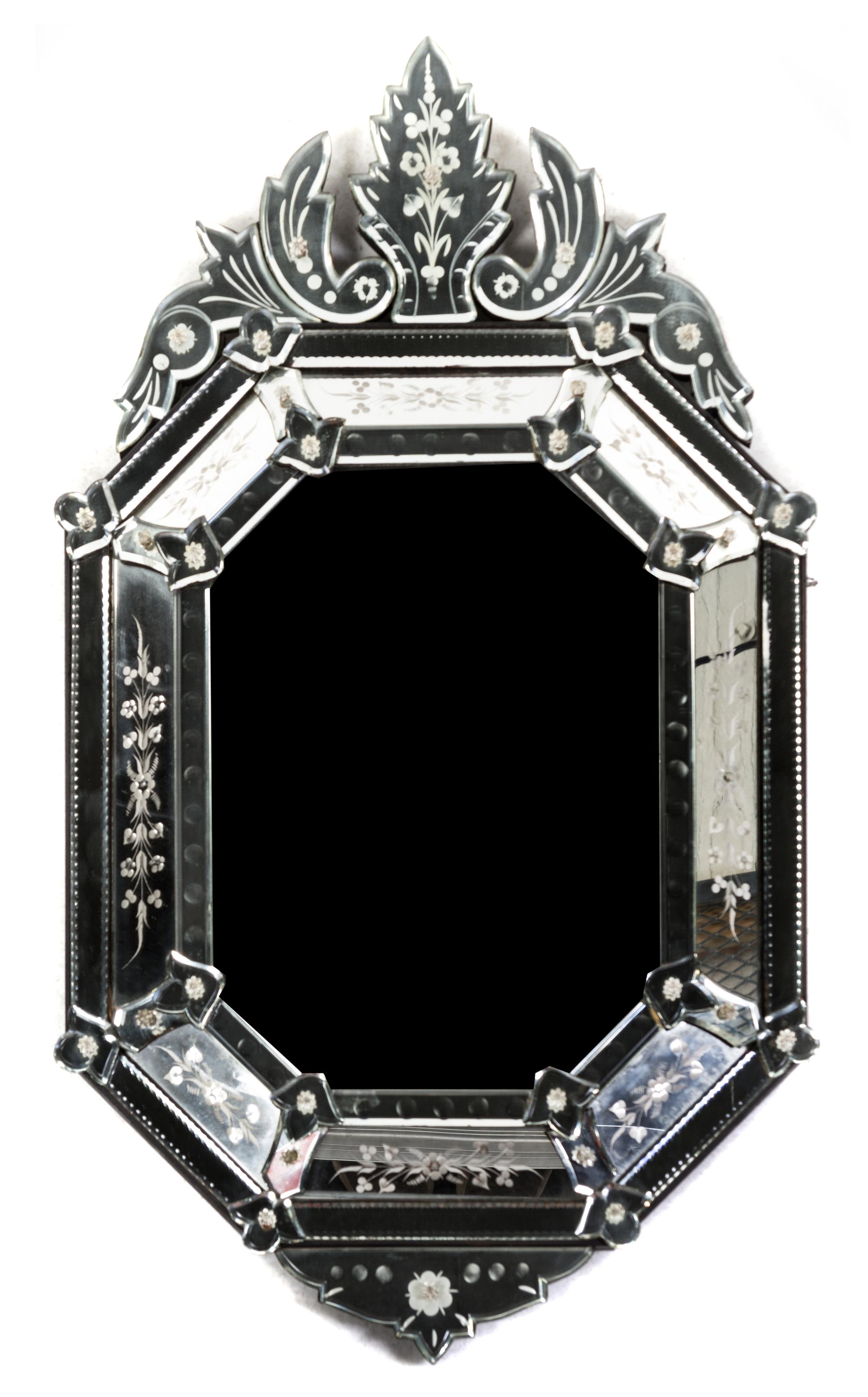 A Venetian Glass Mirror, Height 34 x width 19 3/4 inches.