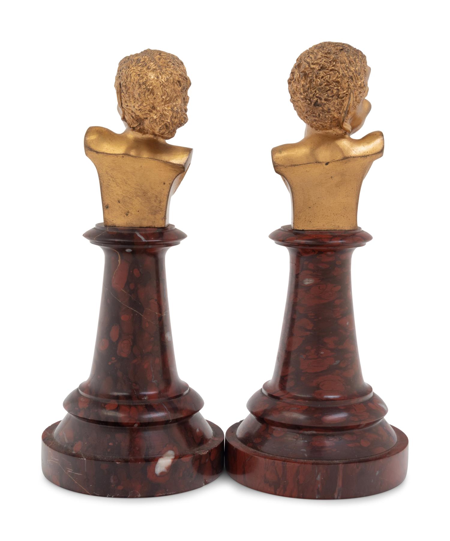 A Pair of French Gilt Bronze and Marble Busts