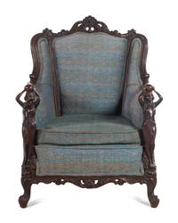 A Pair of Carved Walnut Armchairs in the Style of Karpen Bros.