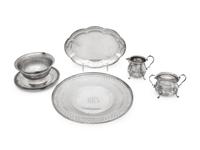comprising a reticulated cake tray, a scalloped plate, a cream and sugar set, and a bowl with attached underplate.