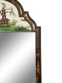 A Regency Style Black Lacquer Chinoiserie Framed Mirror with Reverse Painted Panel