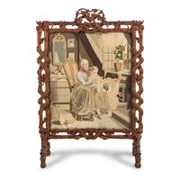 A Swiss "Black Forest" Carved Needlepoint-Inset Firescreen