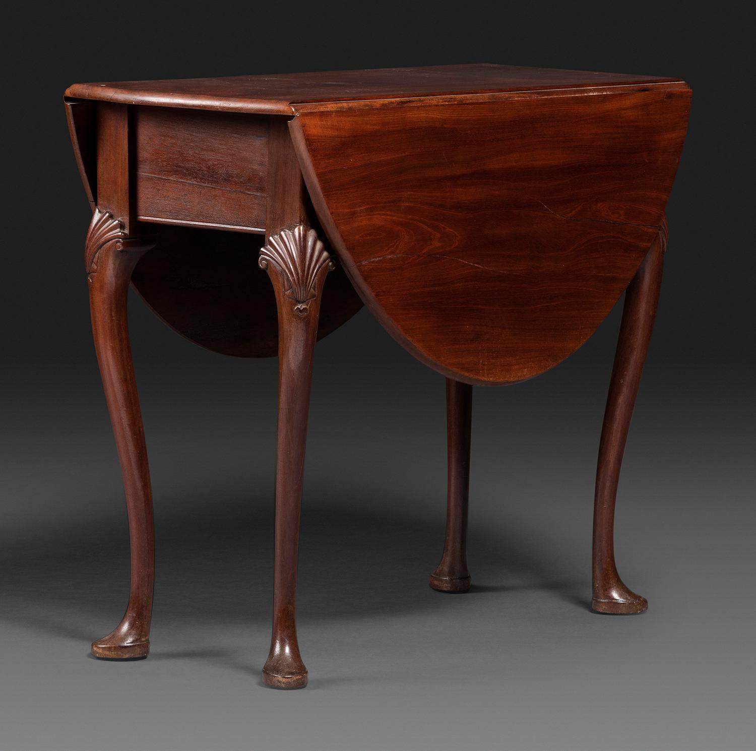 A Queen Anne Shell-Carved Mahogany Drop-Leaf Table