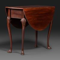 A Queen Anne Shell-Carved Mahogany Drop-Leaf Table