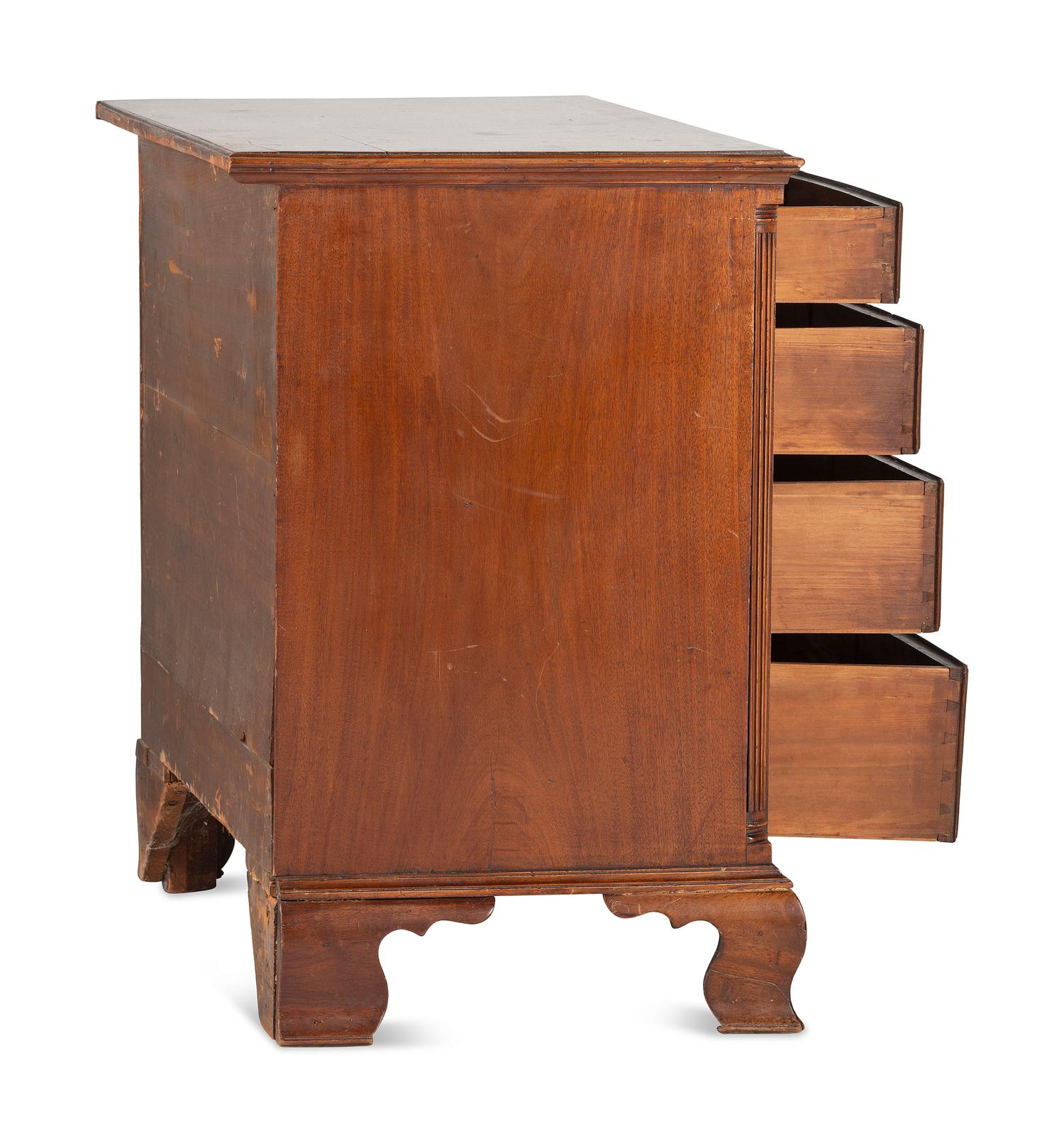 A Chippendale Carved and Figured Mahogany Chest of Drawers
