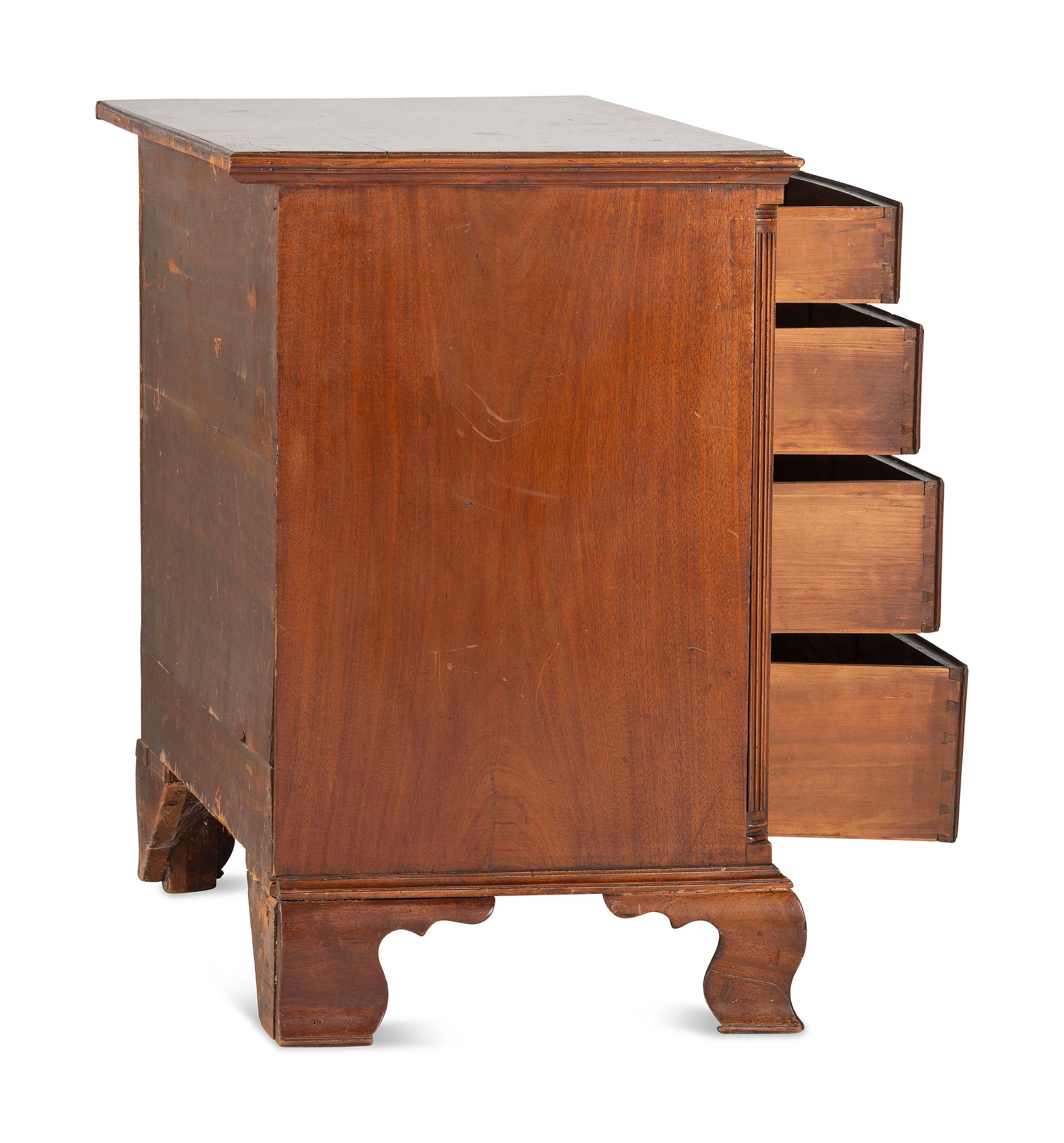 A Chippendale Carved and Figured Mahogany Chest of Drawers
