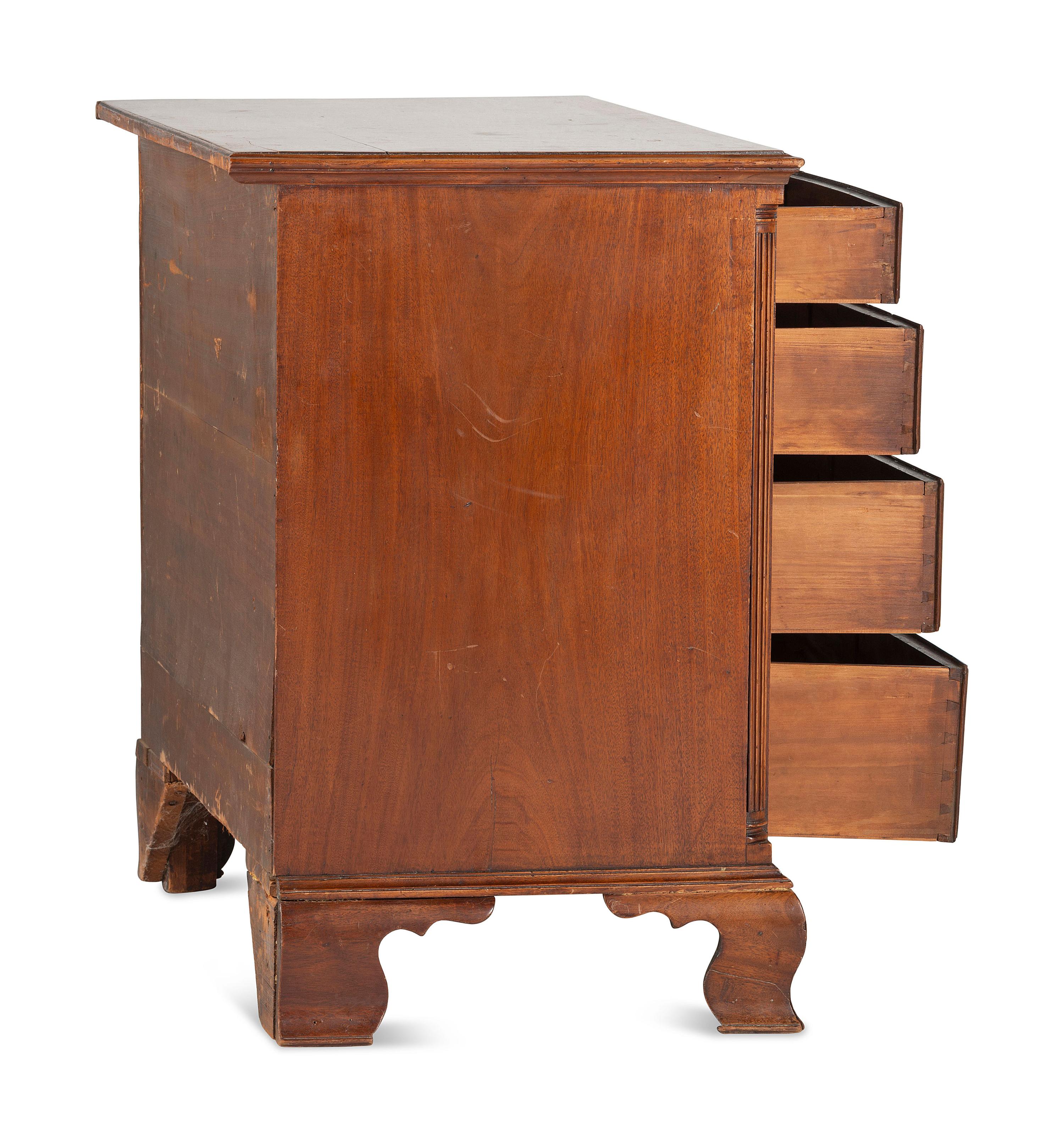 A Chippendale Carved and Figured Mahogany Chest of Drawers