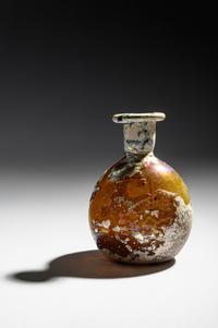A Roman Amber Glass Flask