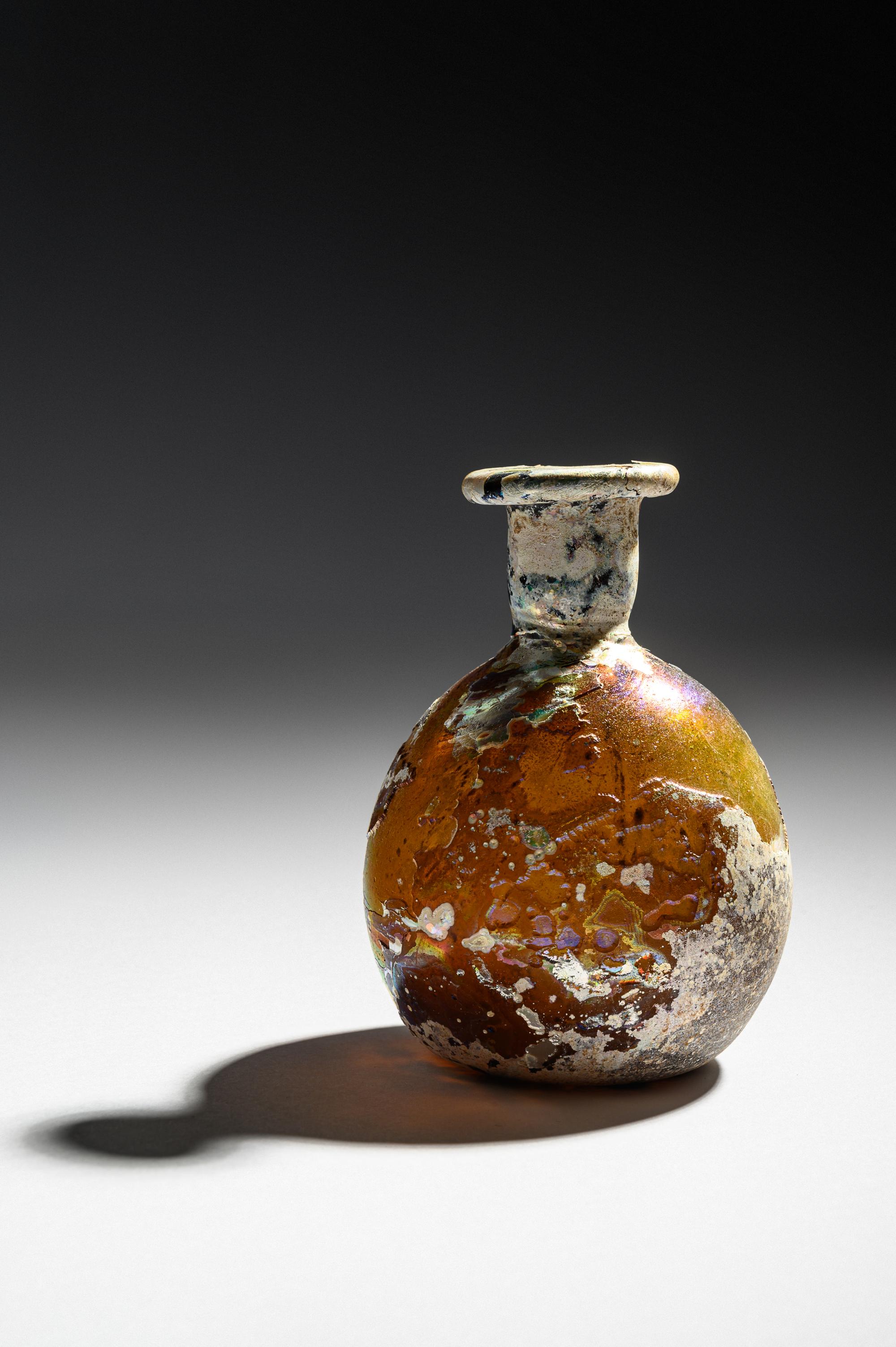 A Roman Amber Glass Flask