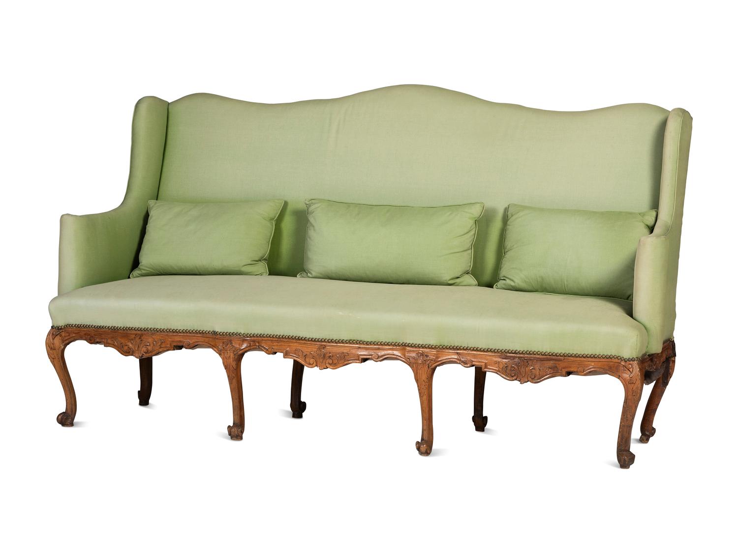 A French Provincial Carved Fruitwood Upholstered High-Back Sofa