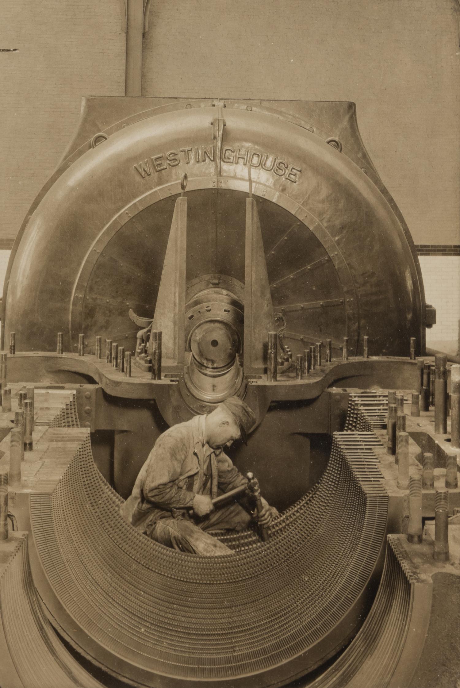 Lewis Hine (1874-1940) The heart of the turbine: Repairing turbine in power house, 1930