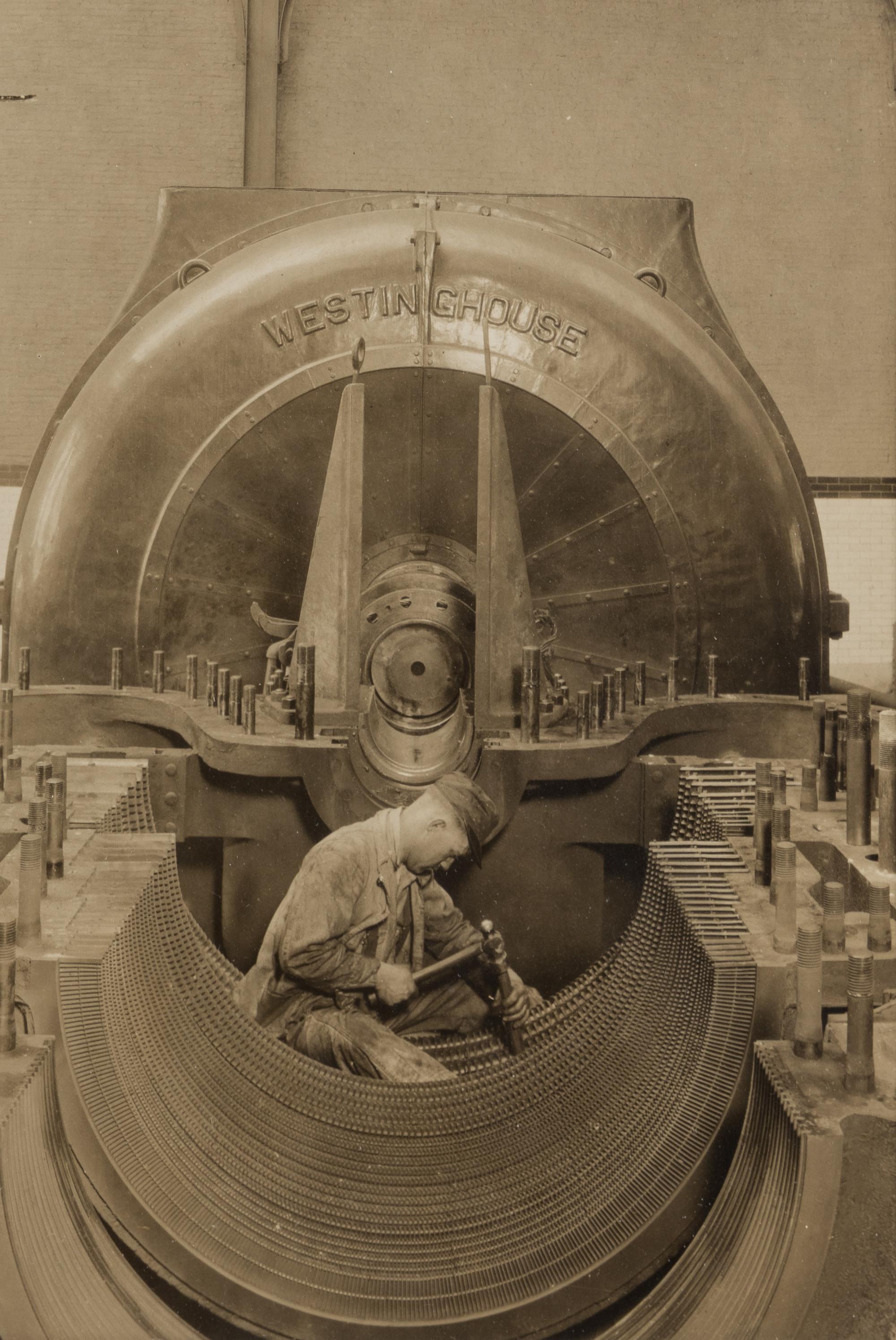 Lewis Hine (1874-1940) The heart of the turbine: Repairing turbine in power house, 1930