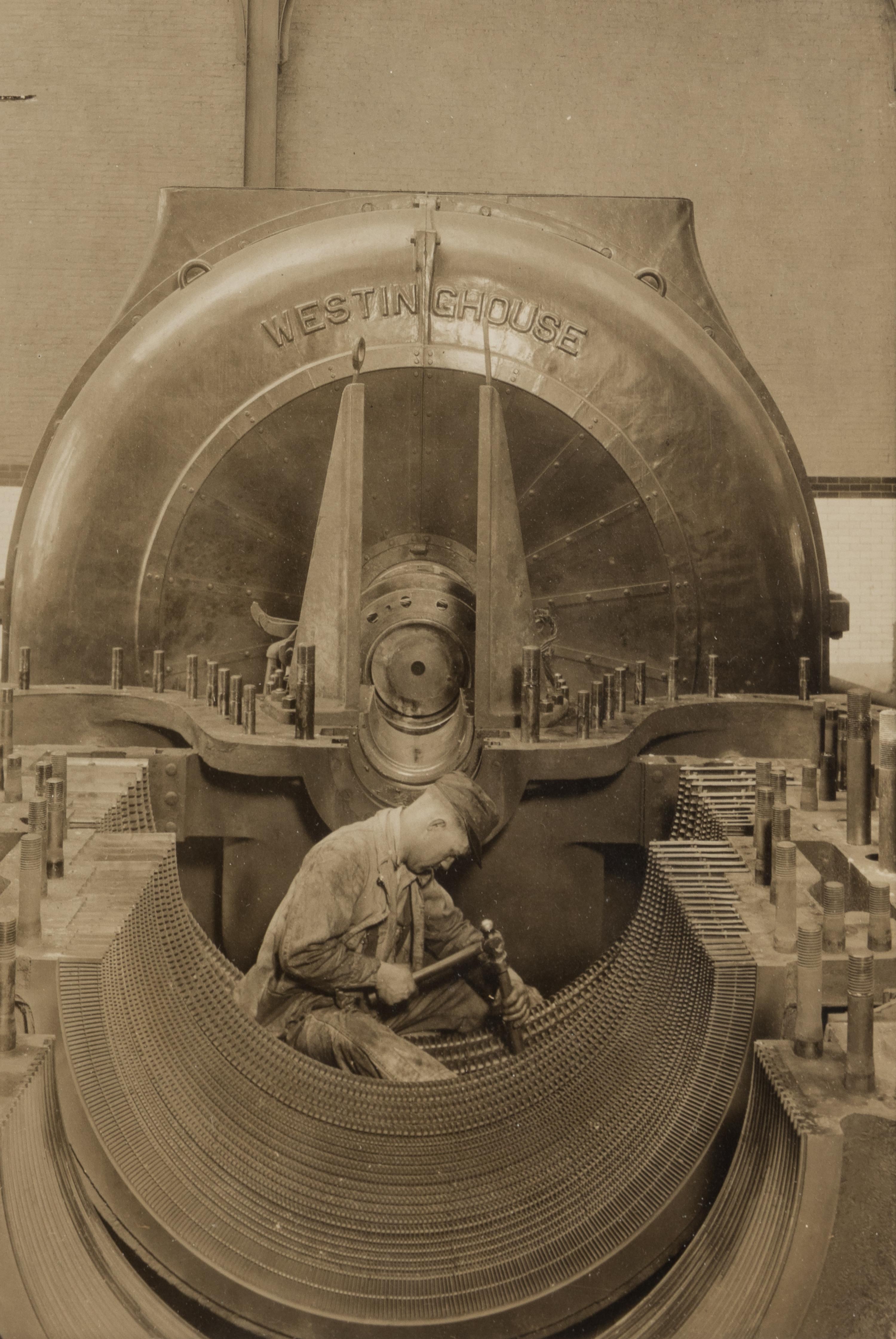 Lewis Hine (1874-1940) The heart of the turbine: Repairing turbine in power house, 1930