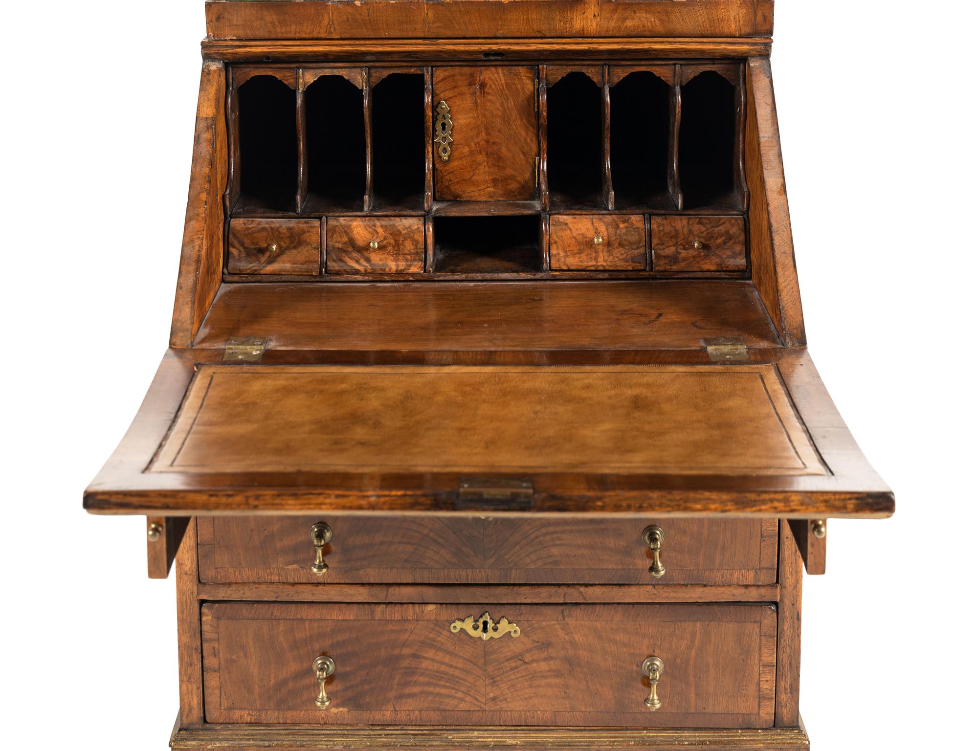A George II Style Parcel Gilt Walnut Bureau Bookcase