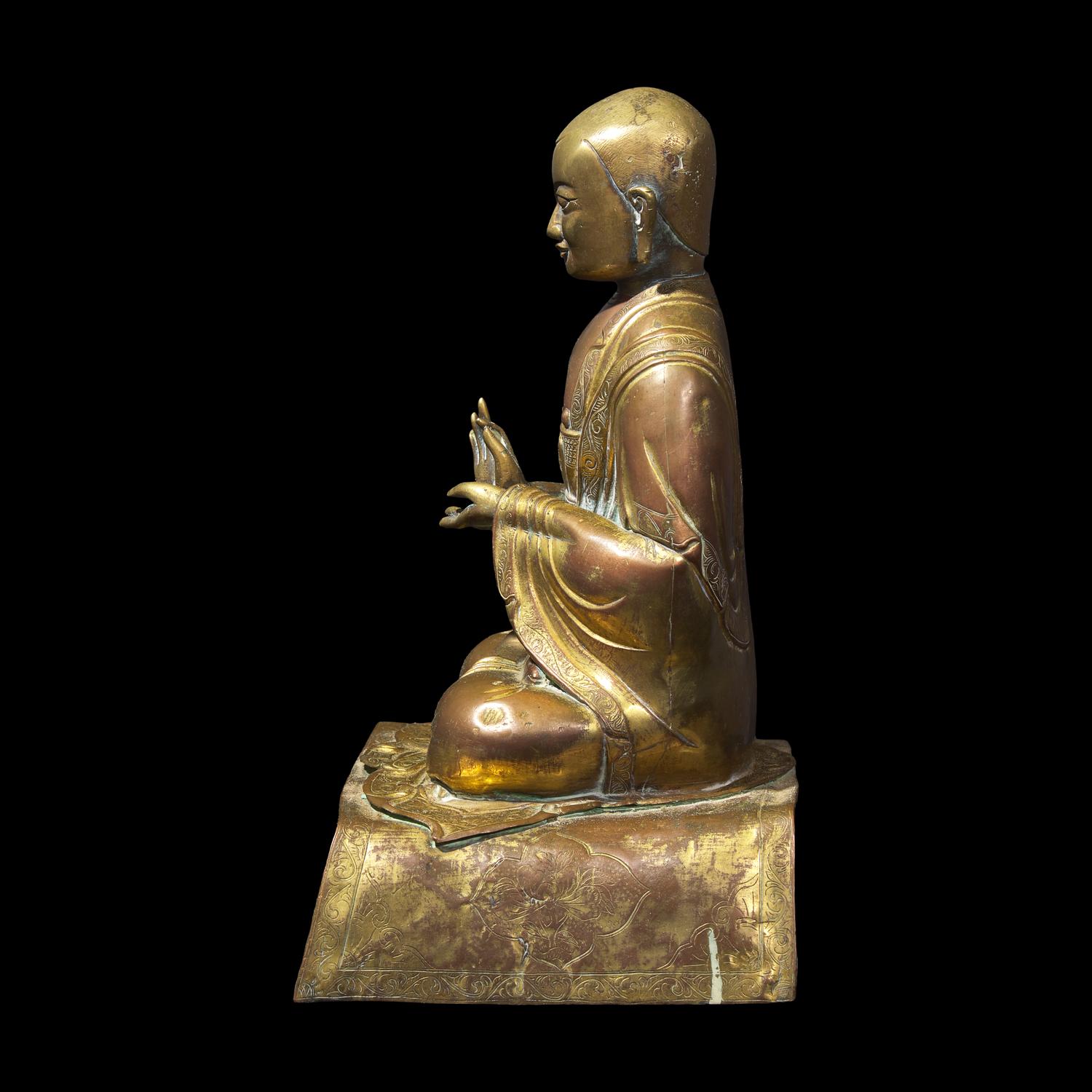 A Gilt Repousse Copper Alloy Figure of a Seated Monk, Probably Dolonor, Inner Mongolia, 18th/19th Century 清中期 銅鎏金上師坐像