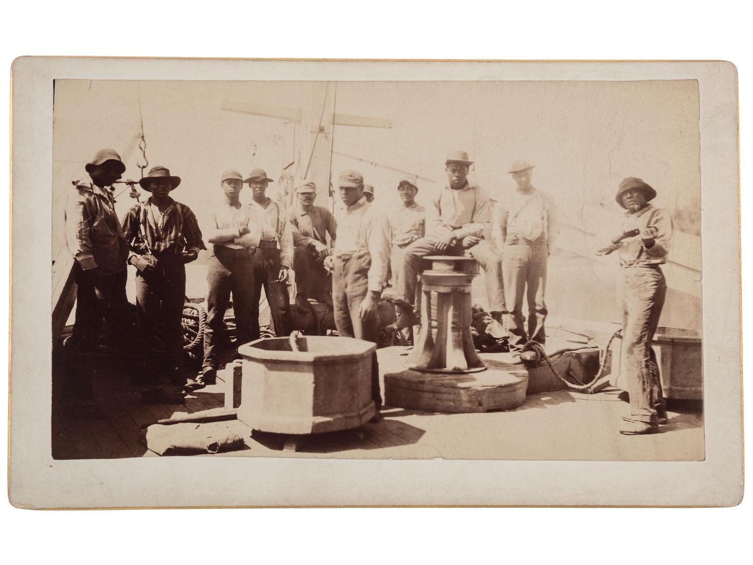 [EARLY PHOTOGRAPHY]. Boudoir card of African American deck hands aboard a ship. Ca 1890.