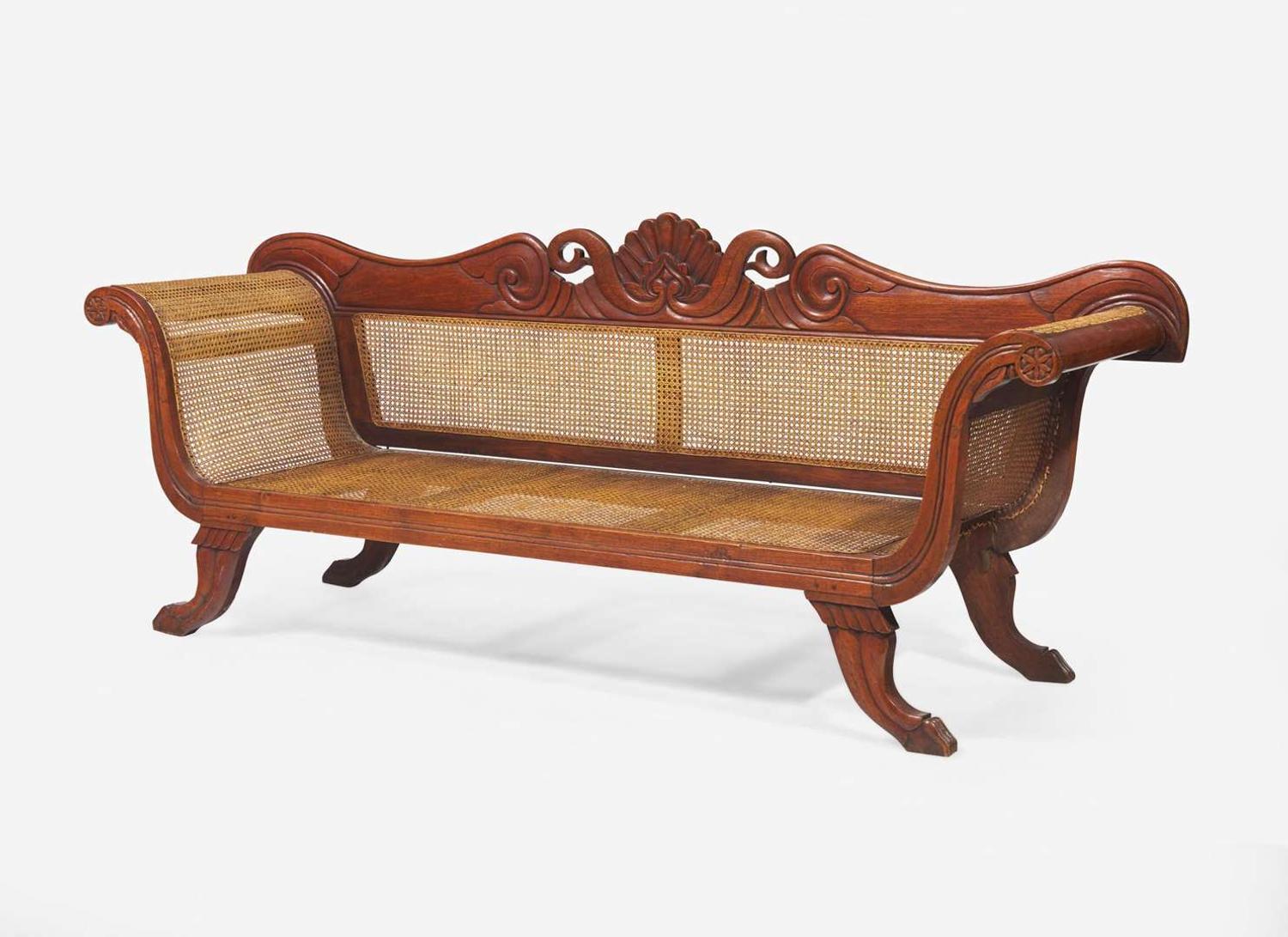 An Anglo-Colonial carved hardwood and caned sofa, first half 19th century
