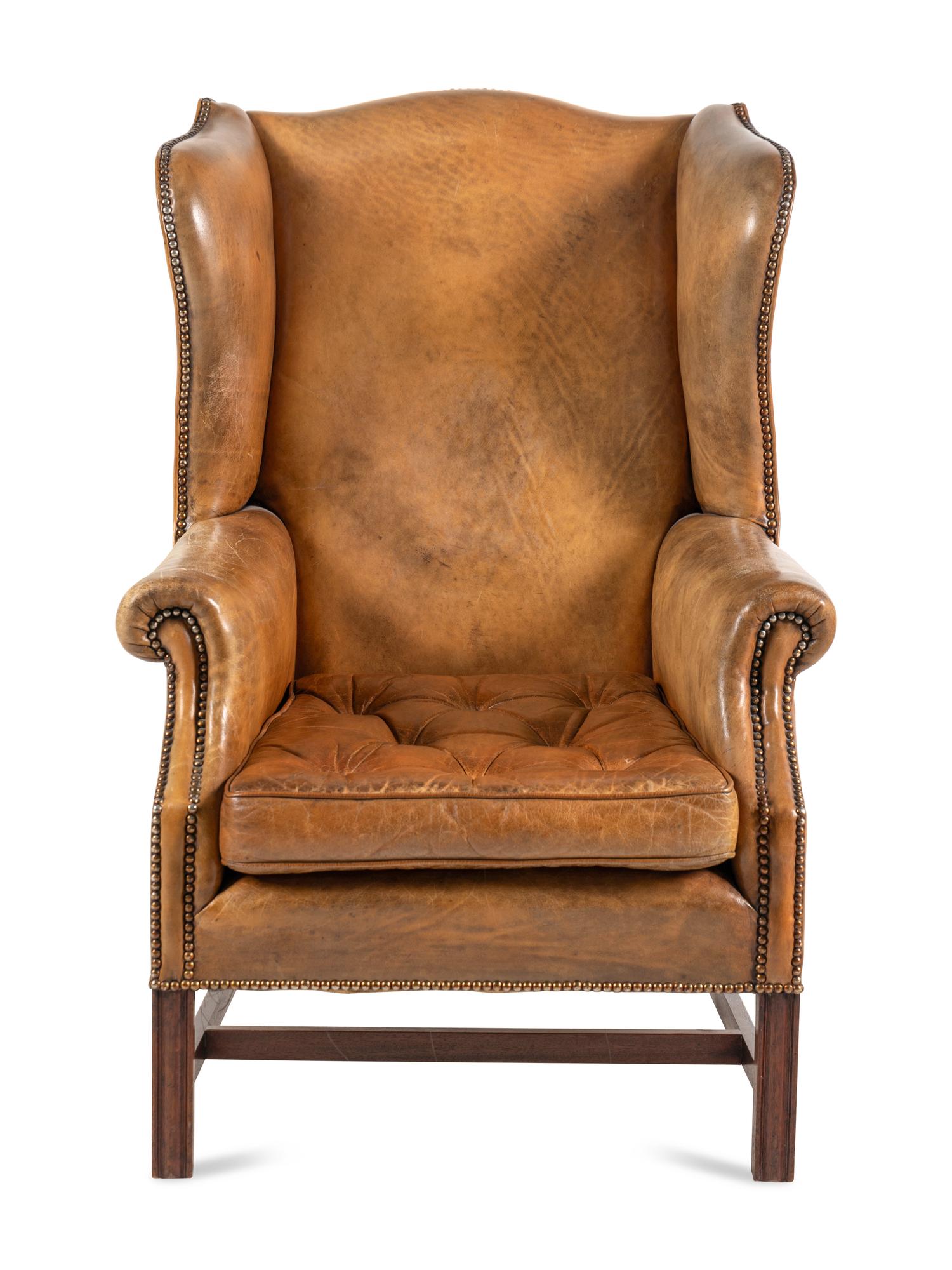 A George III Style Leather Upholstered Wingback Armchair