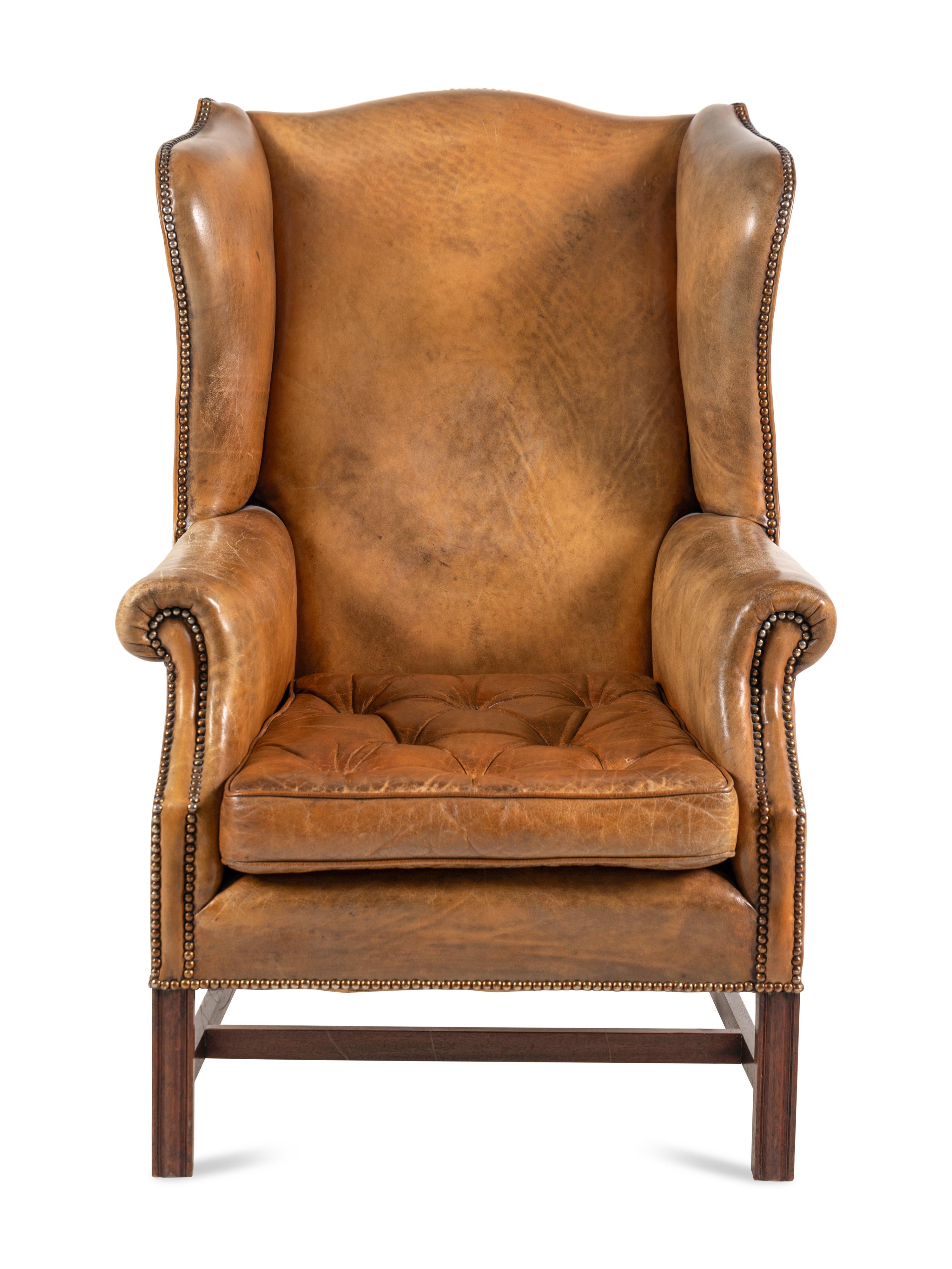 A George III Style Leather Upholstered Wingback Armchair