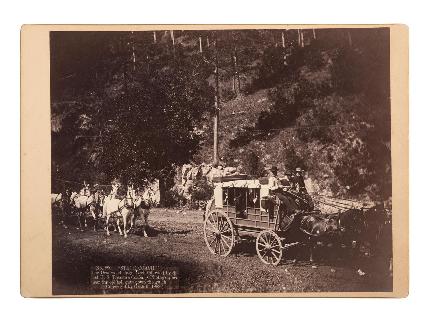 [WESTERN AMERICANA]. GRABILL, John C.H. (1849-1903), photographer. "Stage Coach." The Deadwood stage coach followed by the last US Treasure Coach. [South Dakota],1888.