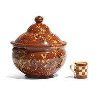 A Glazed and Slip-Decorated Redware Covered Tureen and a Checkered Yellowware Mug