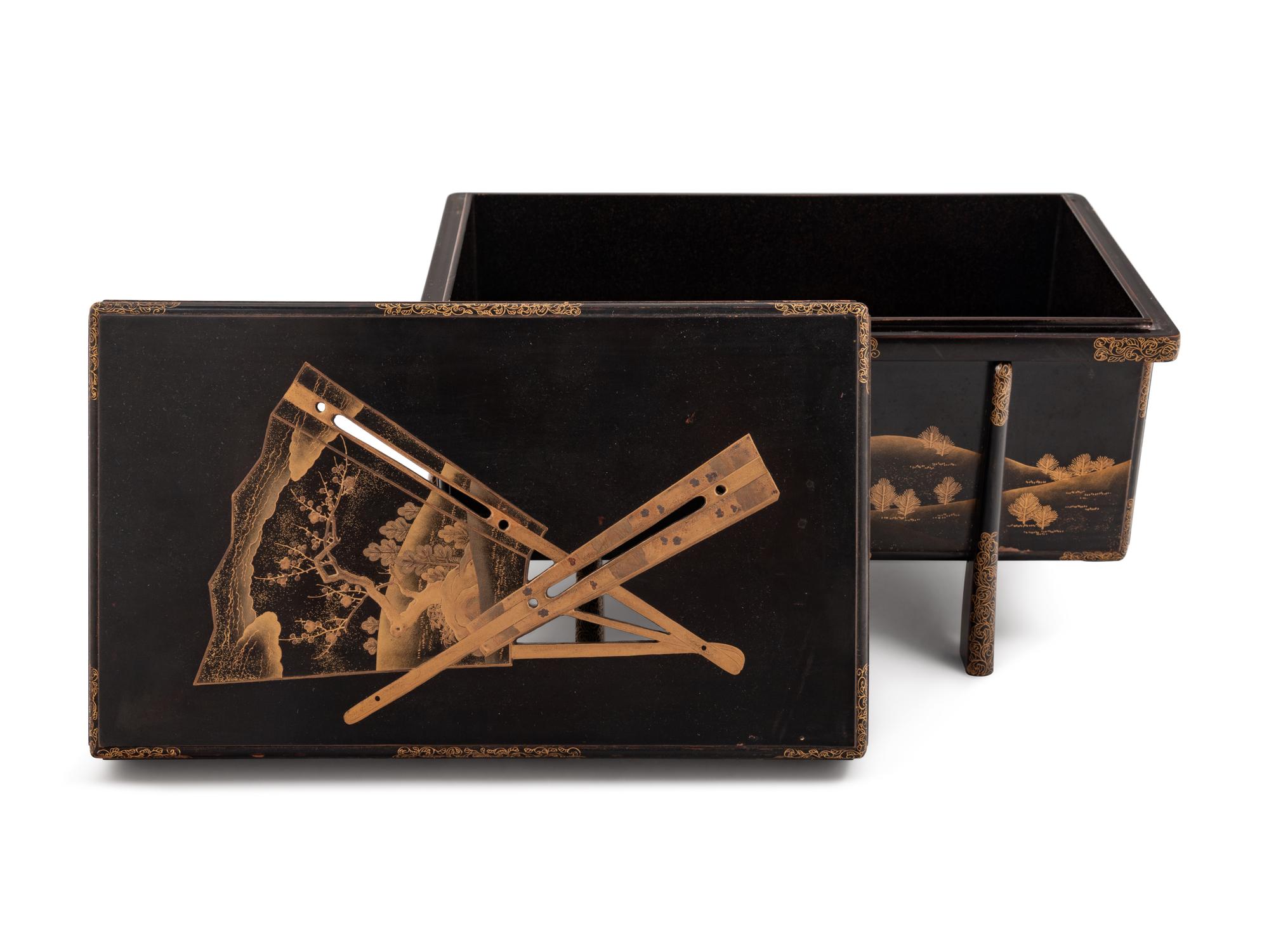 A Small Gilt Decorated Black Lacquer Trunk