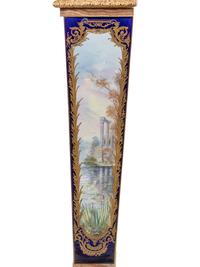 A Pair of Sèvres Style Gilt Bronze Mounted Painted and Parcel Gilt Porcelain and Onyx Pedestals