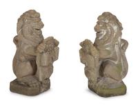 A Pair of Cast Cement Lions Holding Armorial Shields