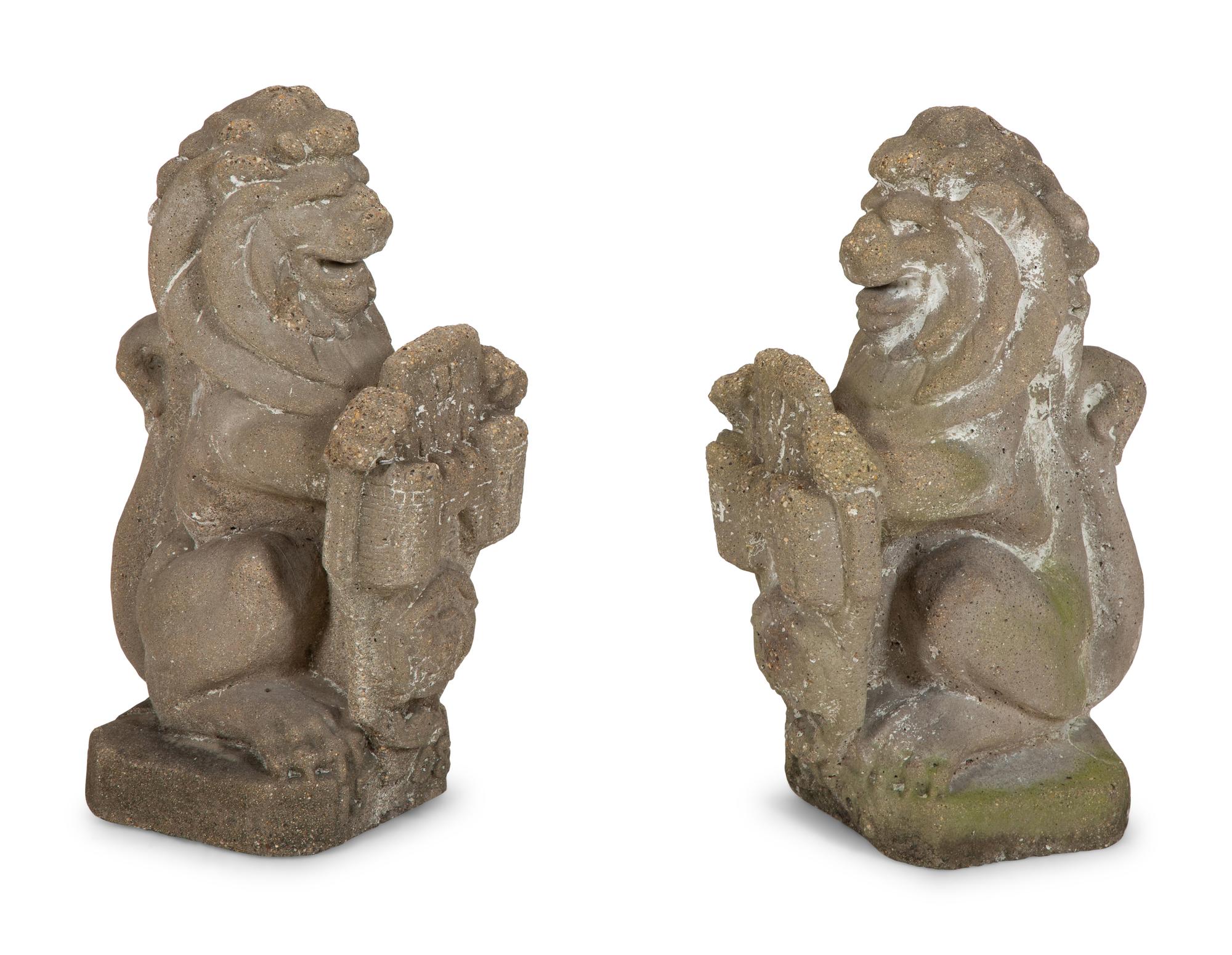 A Pair of Cast Cement Lions Holding Armorial Shields