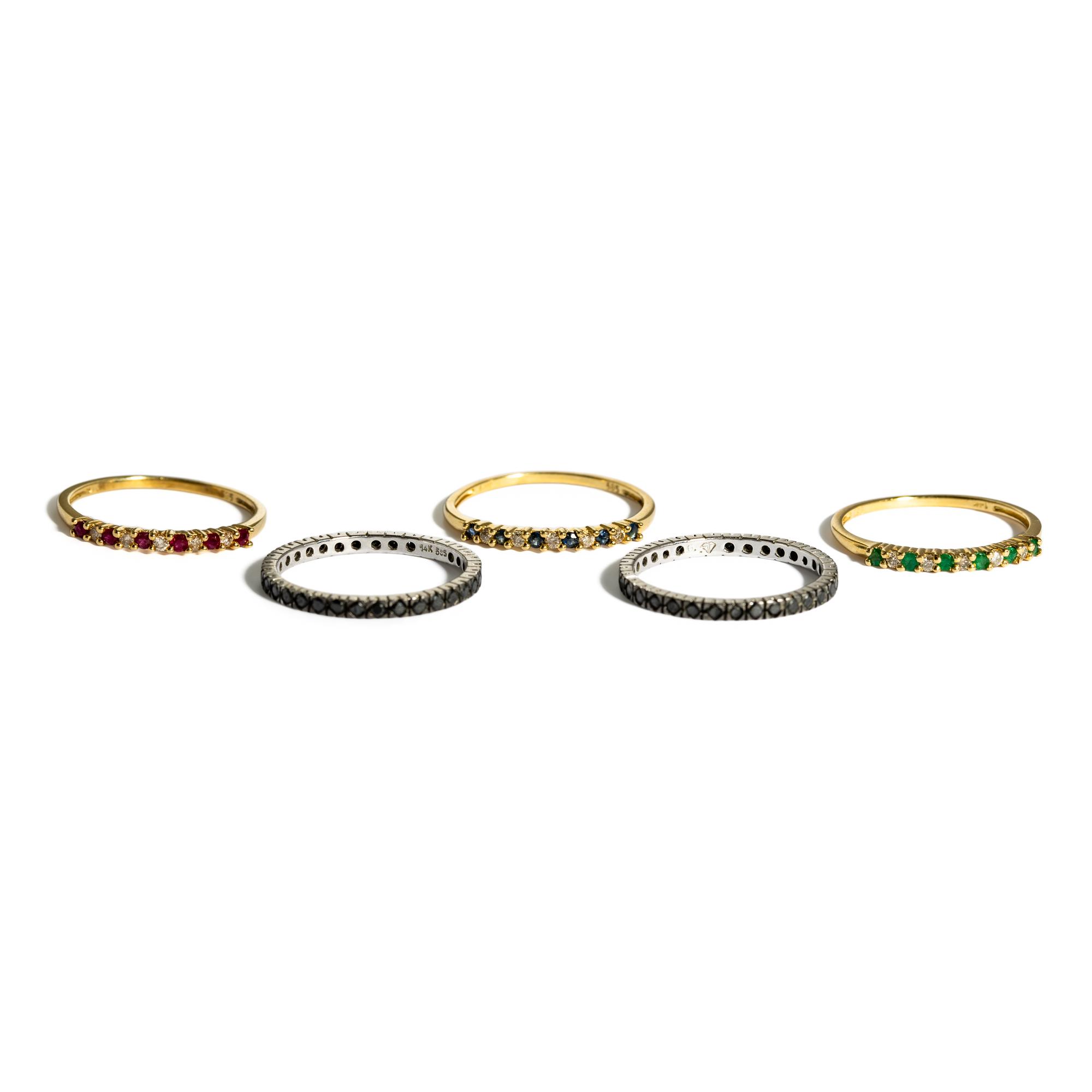 COLLECTION OF FIVE STACKING YELLOW GOLD AND MULITGEM BANDS
