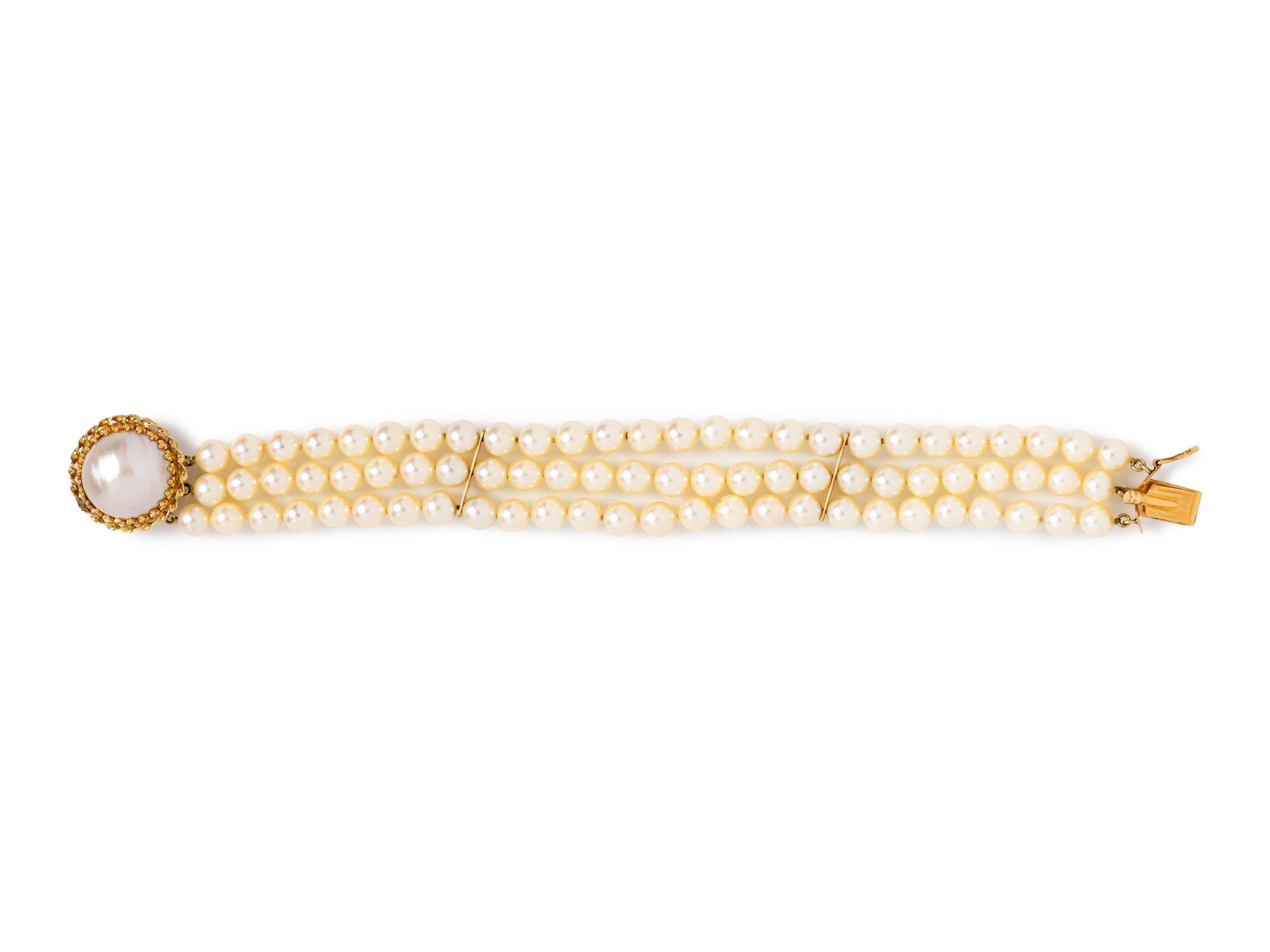 A 14 Karat Yellow Gold and Cultured Pearl Multistrand Bracelet,