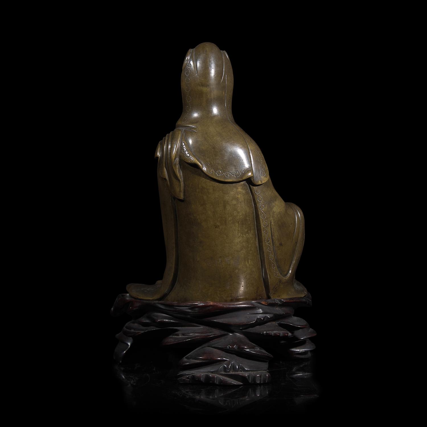 A Patinated Bronze Figure of Guanyin 銅加漆觀音 帶木座