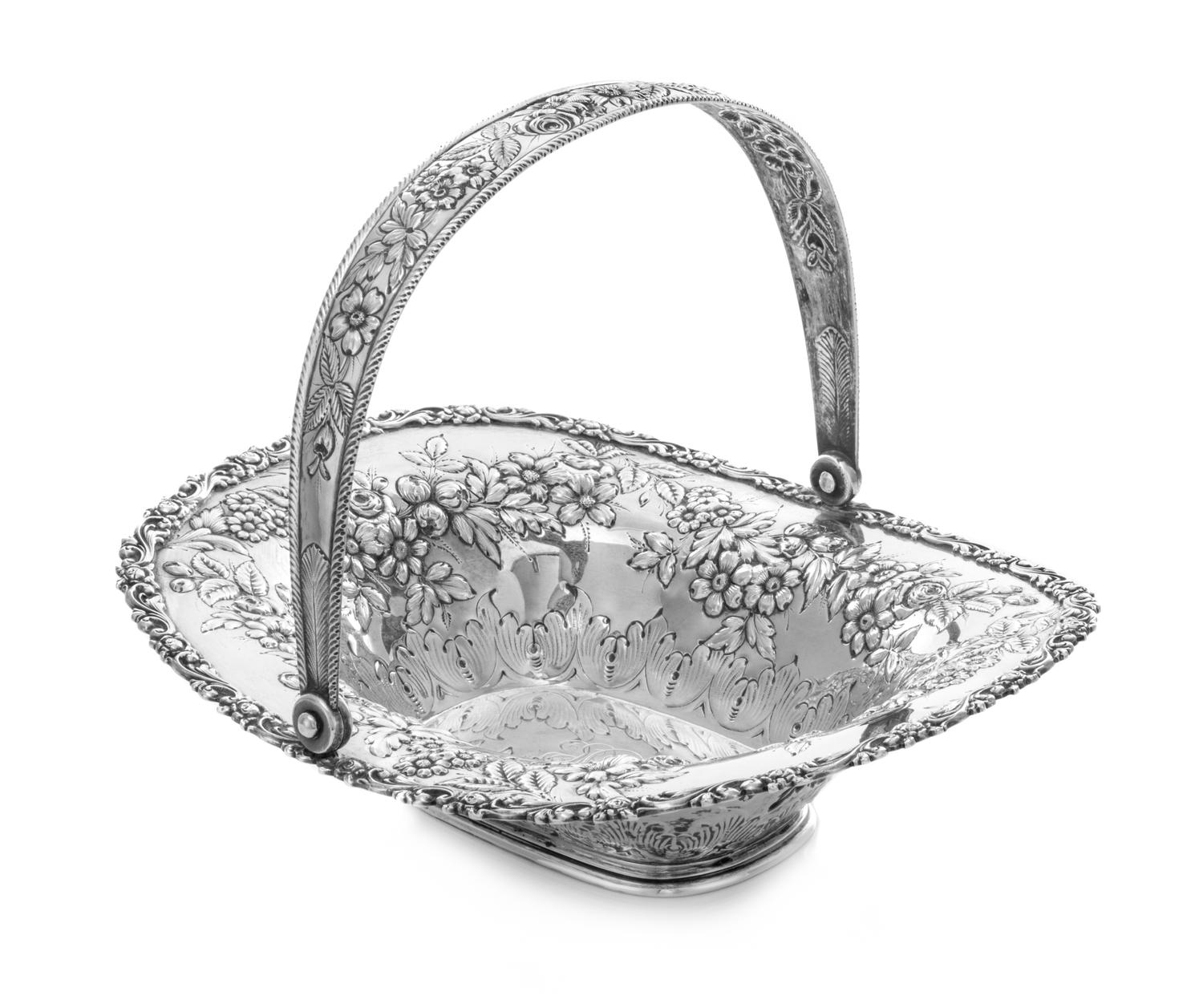 An American Silver Center Bowl, Jacobi & Jenkins, Baltimore, MD, the swivel handle worked to show repousse floral and foliate decoratio