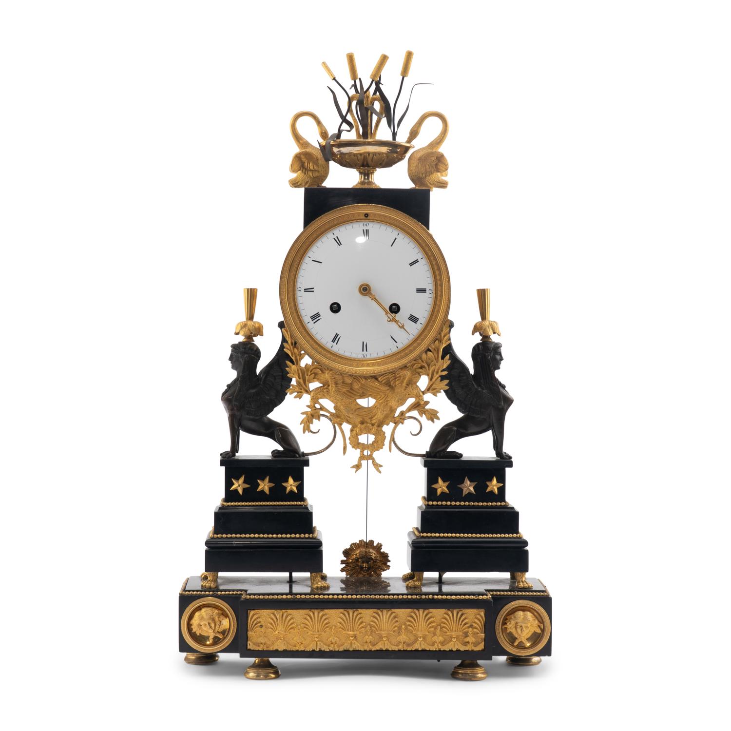 An Empire Ormolu, Black Granite and Patinated Bronze Mantel Clock