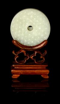 A Chinese White Jade Bi Disc