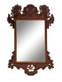 A George III Style Carved and Parcel Gilt Mahogany Mirror