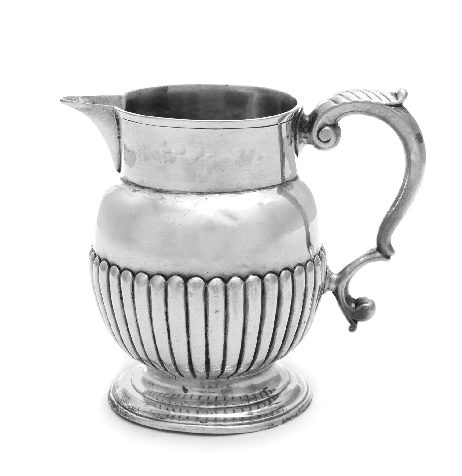A George III Silver Creamer, Maker's Mark Obscured, London, 1814, the lower half of the body with ribbed decoration.