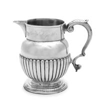 A George III Silver Creamer, Maker's Mark Obscured, London, 1814, the lower half of the body with ribbed decoration.