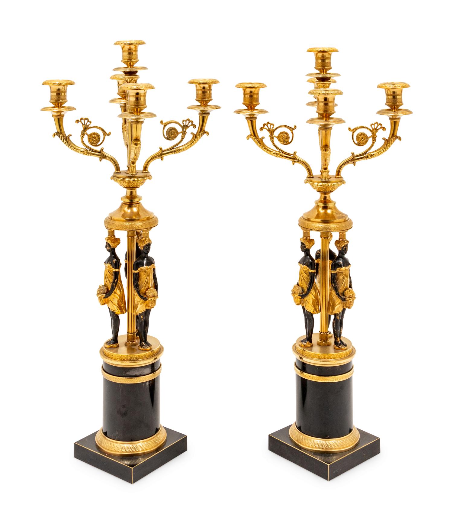 A Pair of Empire Style Gilt and Patinated Metal Figural Candelabra