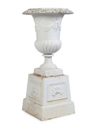 A Set of Four Victorian Style Painted Cast Iron Urns and Plinths