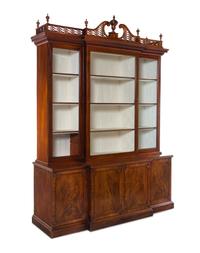 A Late George III Pierce Carved and Figured Mahogany Breakfront Cabinet