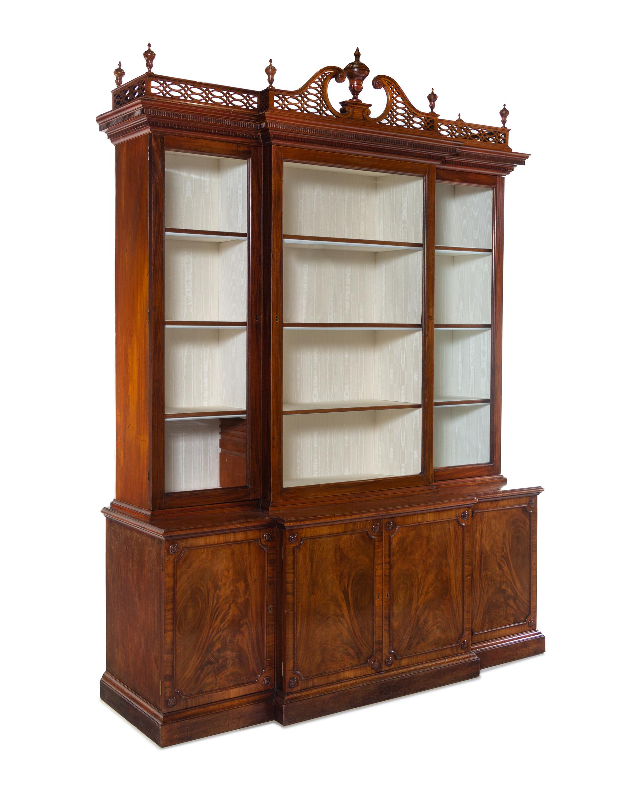 A Late George III Pierce Carved and Figured Mahogany Breakfront Cabinet